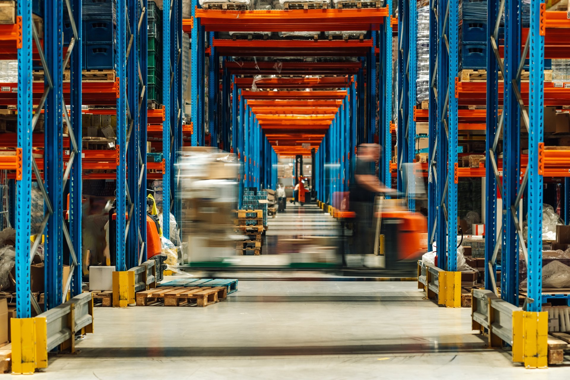 Modern warehouse with cargo containers for asset tracking
