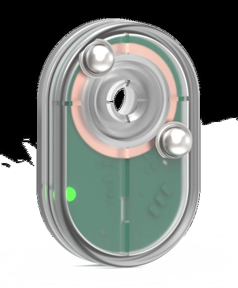 Transparent camera lens module showing circular optics, silver metallic elements, green circuit board base, and a small green indicator light